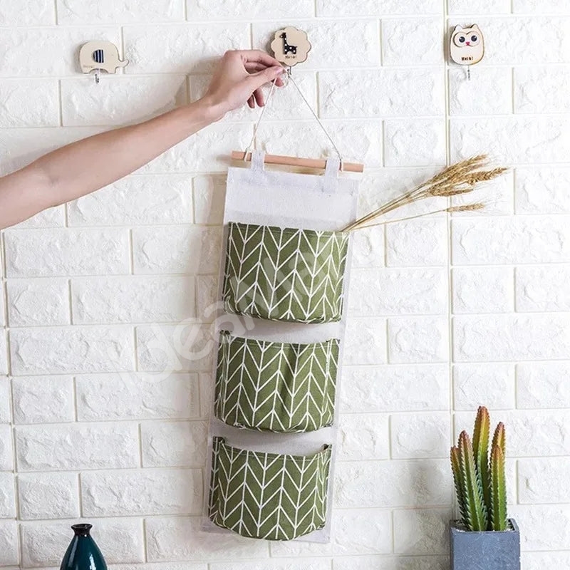 wall-hanging-fabric-storage-organizer-with-3-tier-pockets-and-wooden-rod-product-image